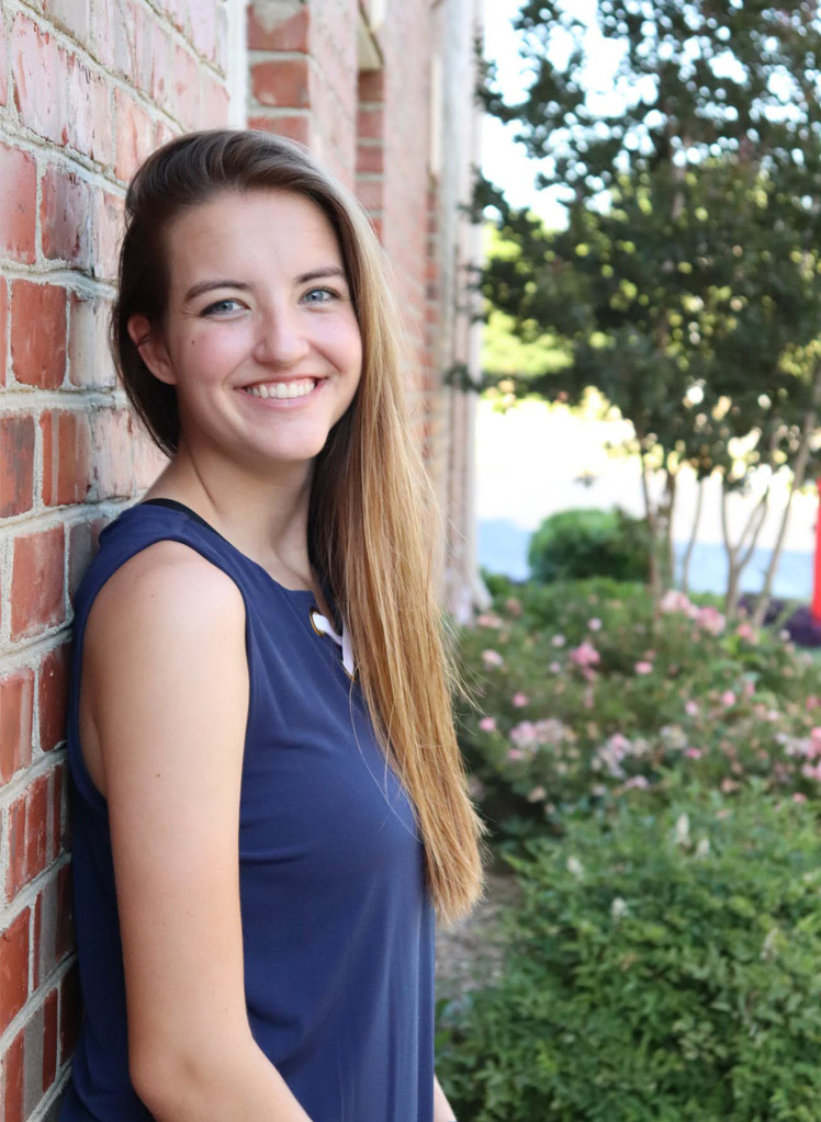 Headshot of a girl in a blue dress